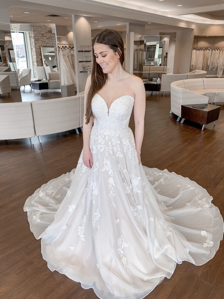 Bride wears a strapless blush ballgown at One Fine Day Bridal and Gown Boutique in Fort Wayne, Indiana