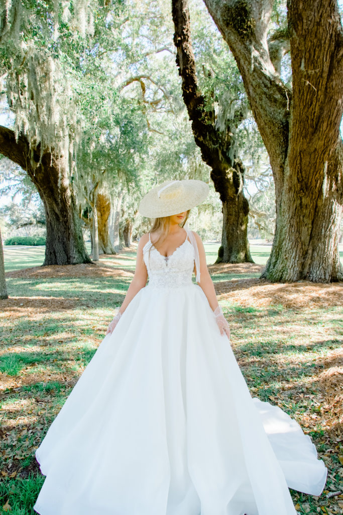 lace and organza wedding dress with straw hat and lace gloves
